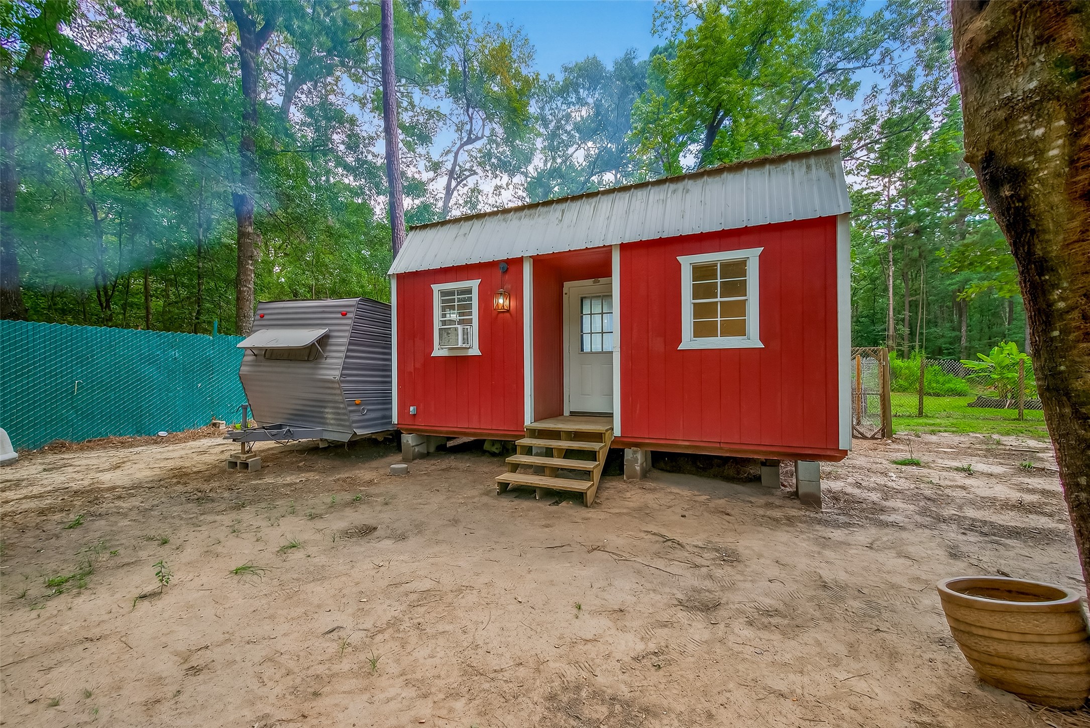 200 Our Road Shepherd, TX 77371 - Photo 25 of 46 a backyard of a house with barbeque oven and yard