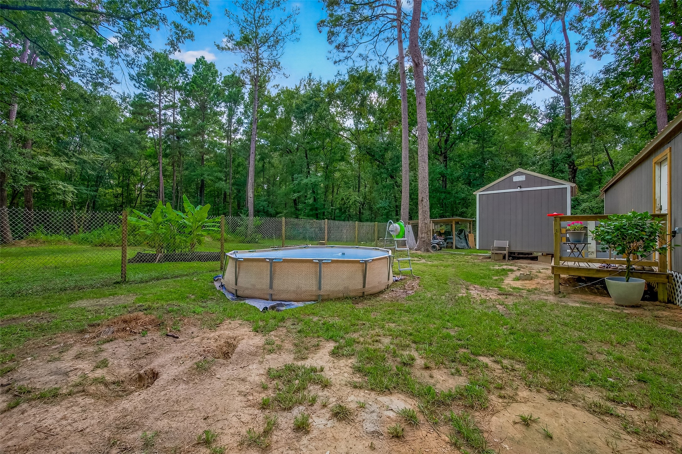 200 Our Road Shepherd, TX 77371 - Photo 28 of 46 a view of a backyard with a garden and trees