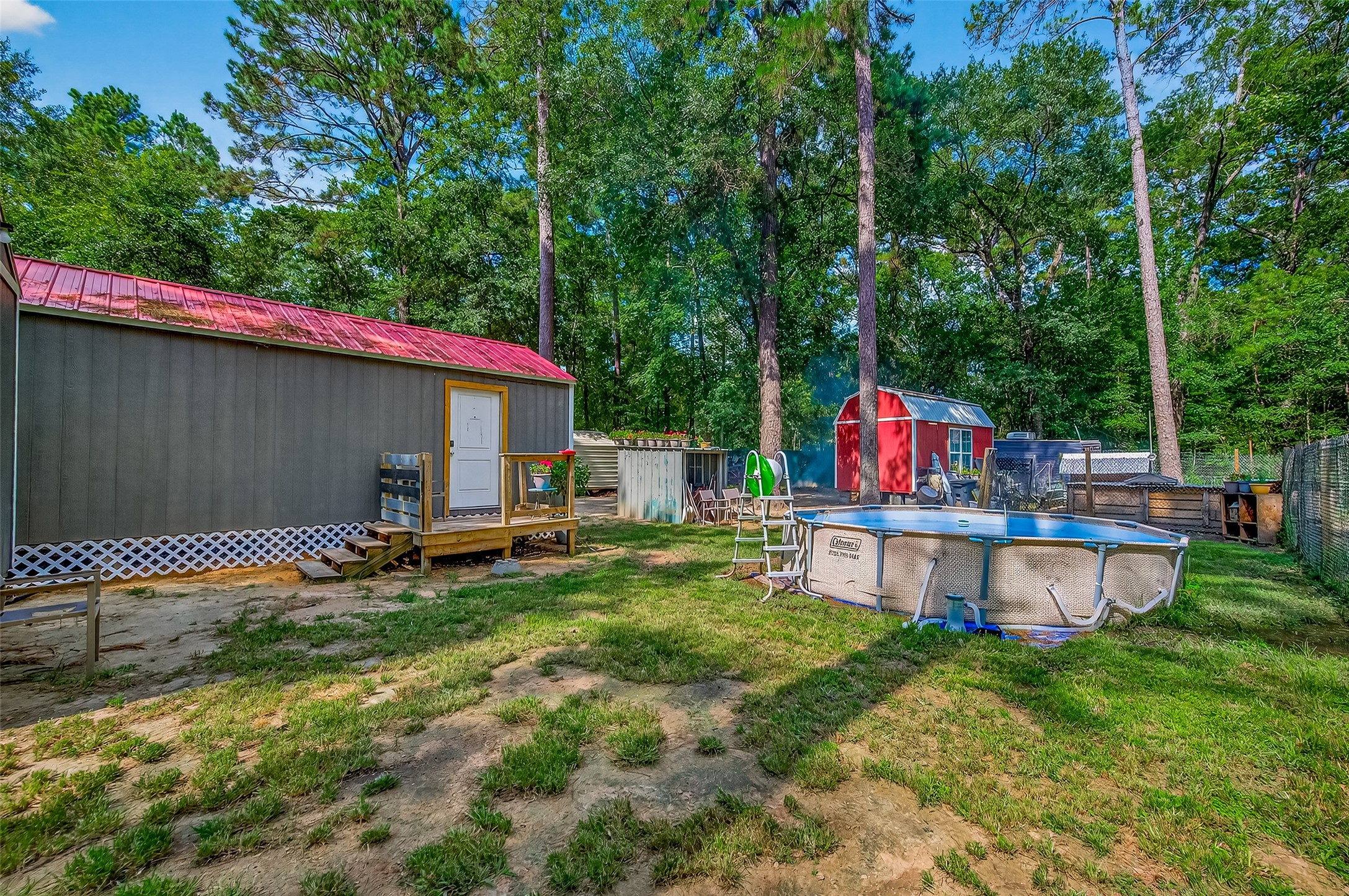 200 Our Road Shepherd, TX 77371 - Photo 30 of 46 a view of a chair and table on the backyard