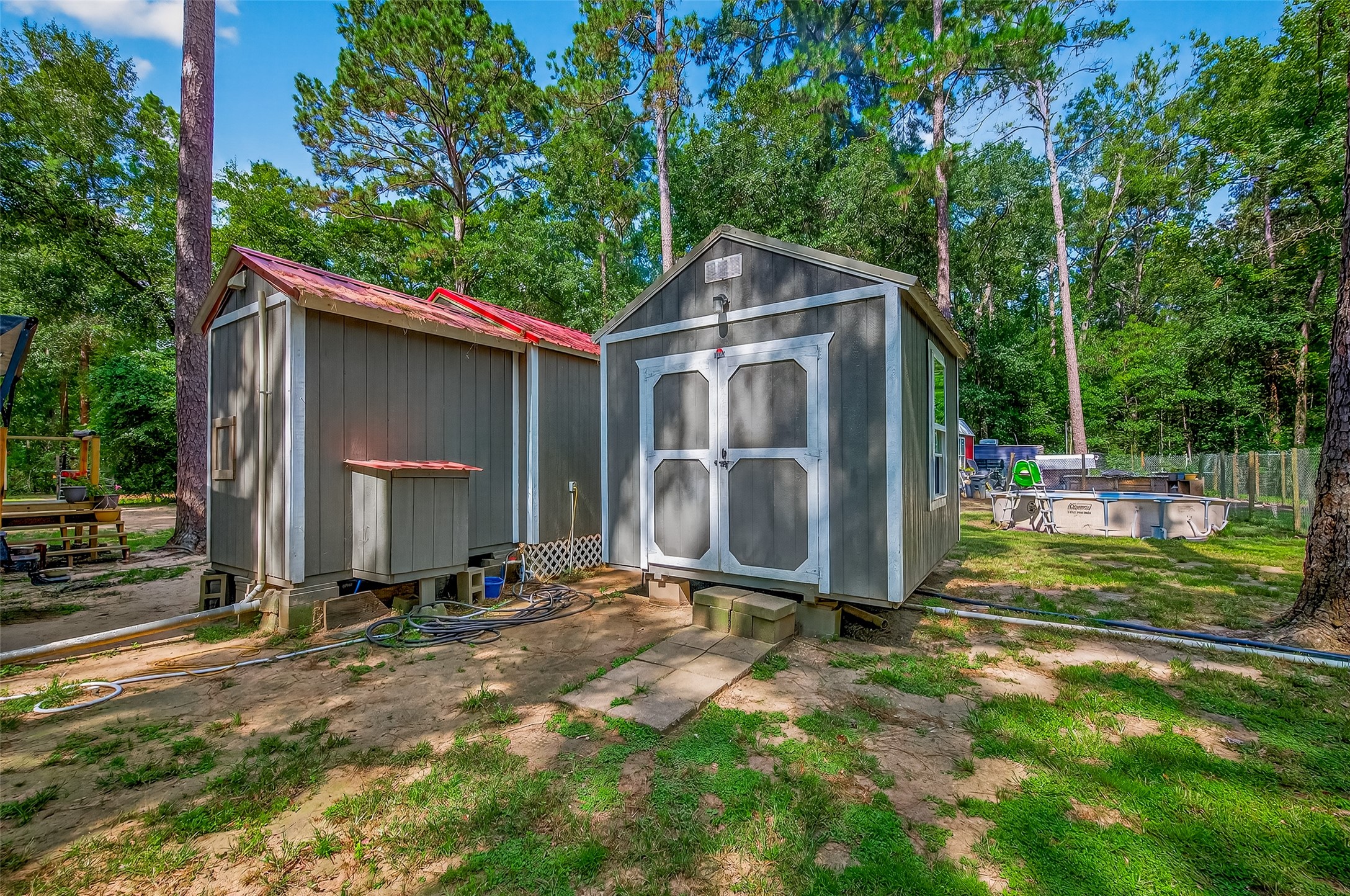 200 Our Road Shepherd, TX 77371 - Photo 32 of 46 a view of backyard with wooden fence and a large tree