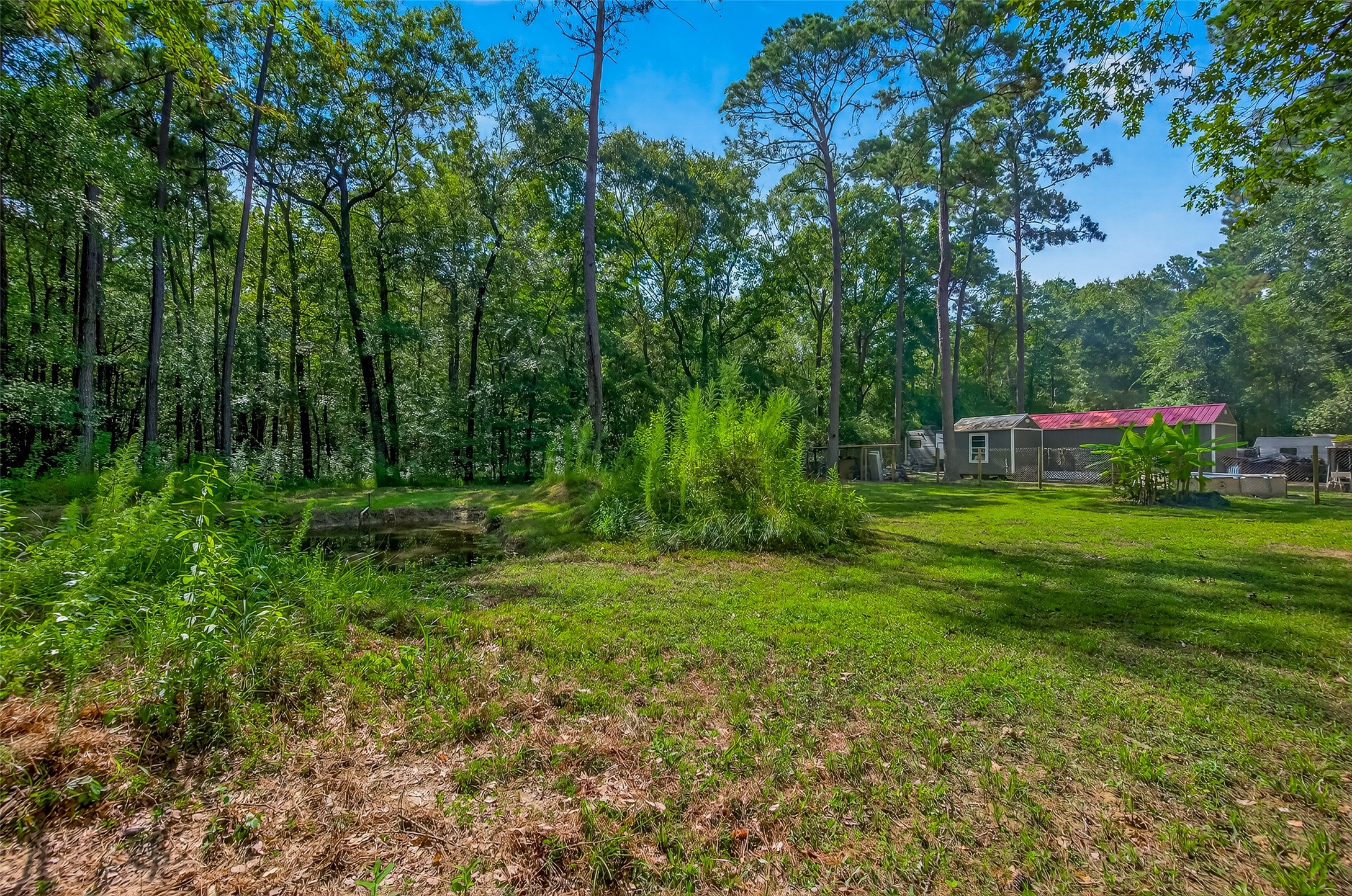 200 Our Road Shepherd, TX 77371 - Photo 38 of 46 a view of a house with a yard