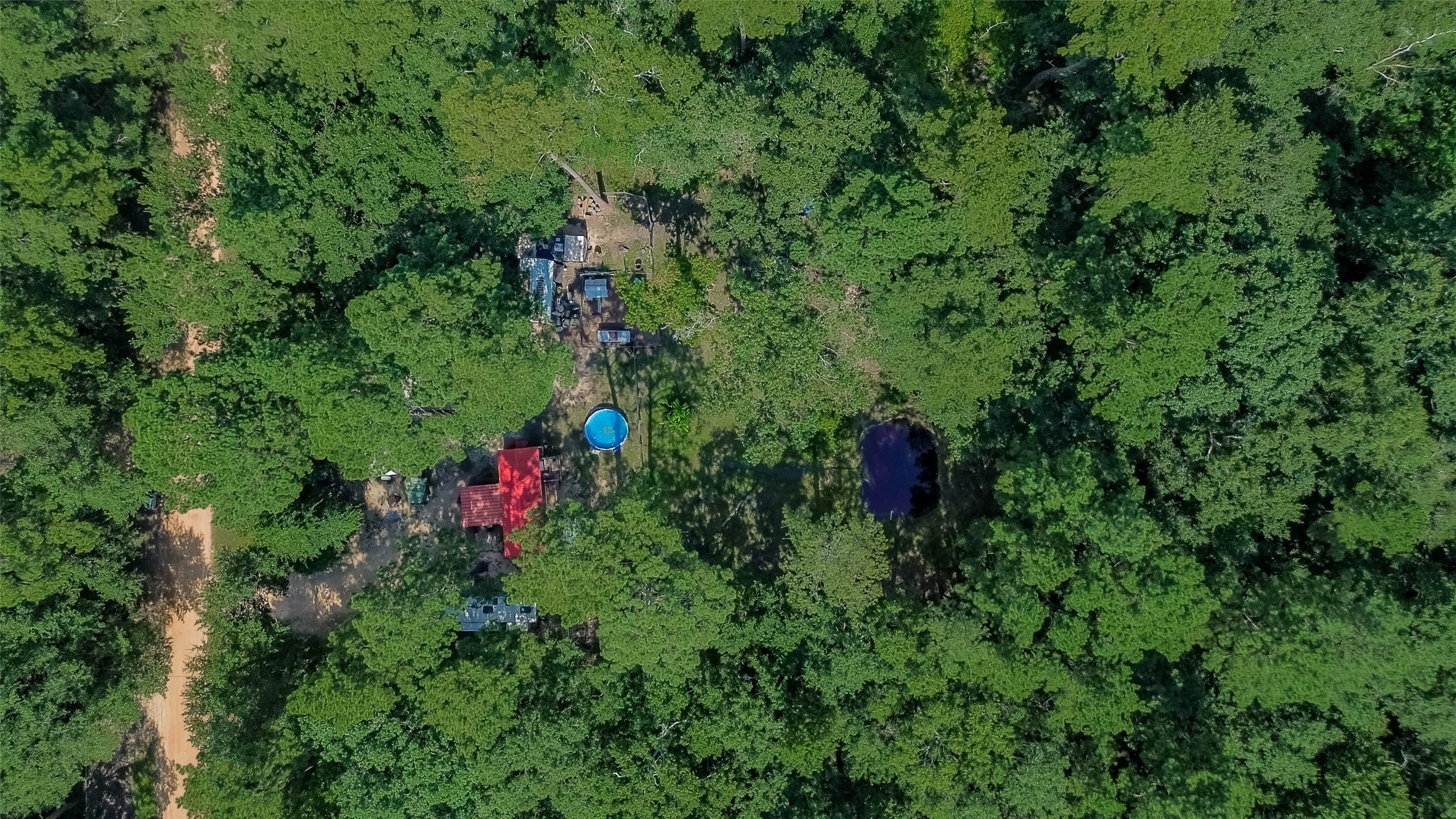 200 Our Road Shepherd, TX 77371 - Photo 42 of 46 a view of a house with a park