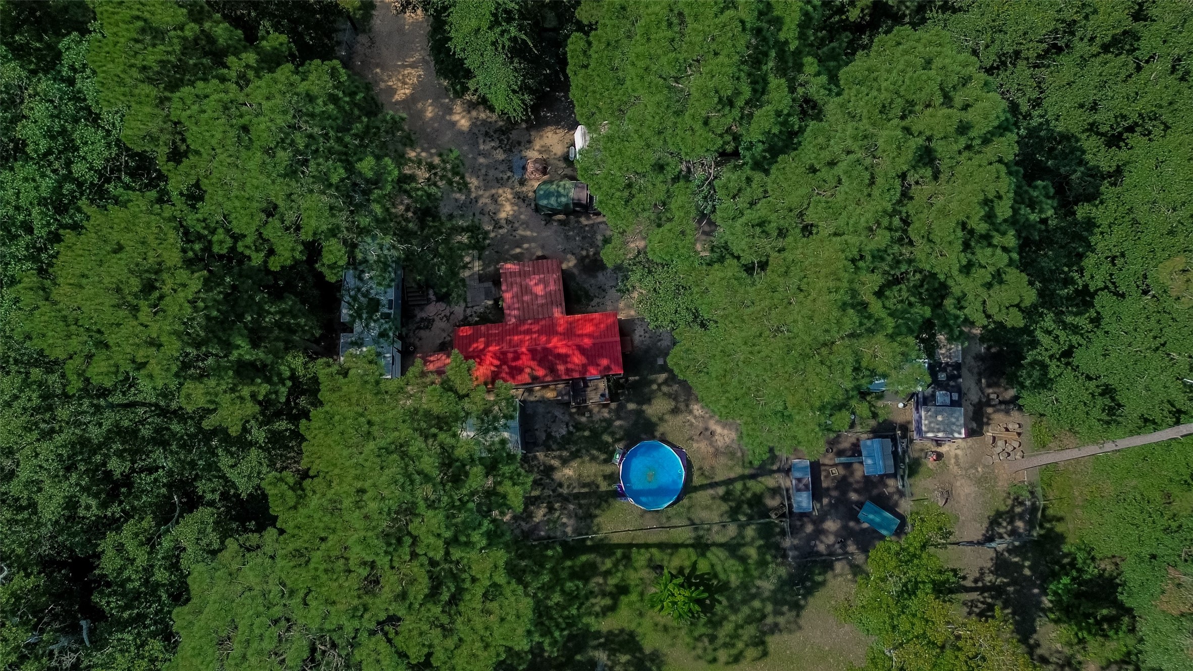 200 Our Road Shepherd, TX 77371 - Photo 46 of 46 an aerial view of a house with a yard and lake view