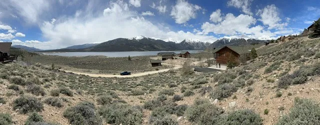 a view of a lake in middle of the forest