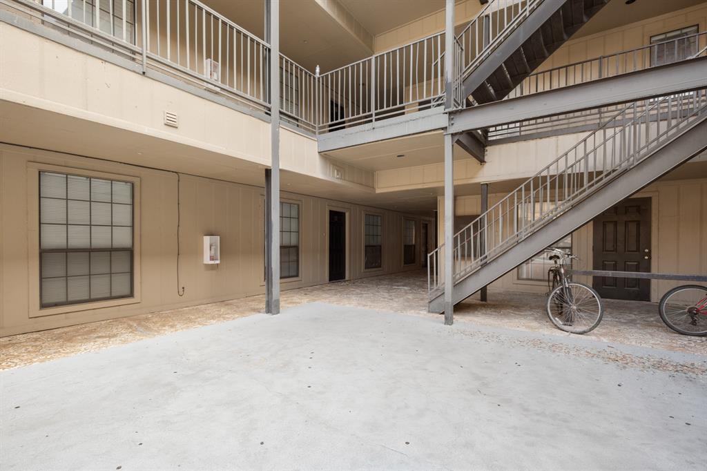 2401 Leon Street, Unit 105 Austin, TX 78705 - Photo 18 of 18 a view of a hallway with staircase