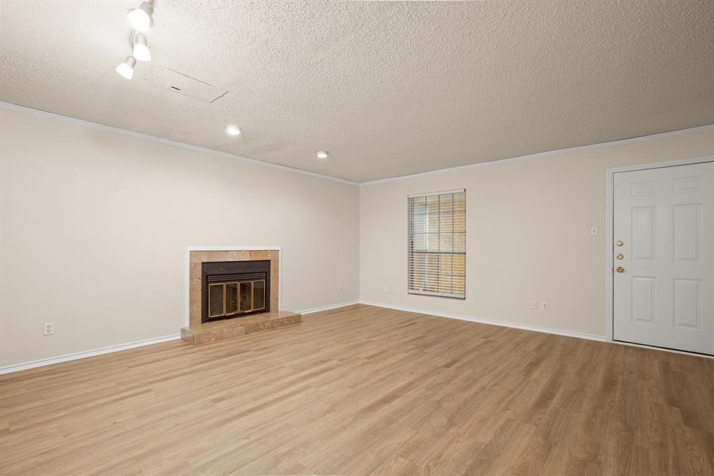 2401 Leon Street, Unit 105 Austin, TX 78705 - Photo 2 of 18 a view of an empty room with wooden floor