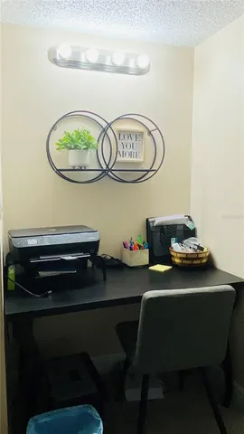 a room with a table chairs and a stove