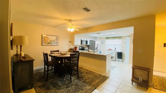 a view of a dining room with furniture and a table