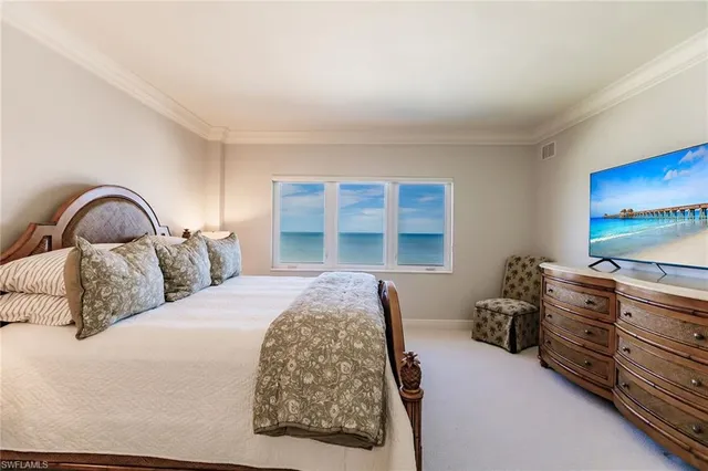 a bedroom with a bed and dresser