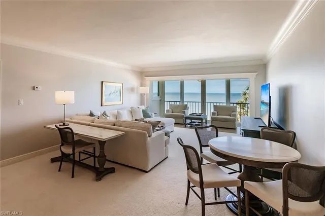 a living room with furniture and a table