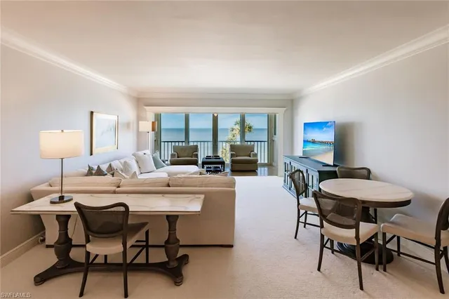 a view of a dining room with furniture and window
