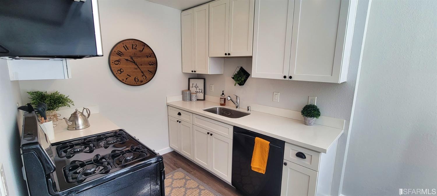 1200 Kenwal Road, Unit D Concord, CA 94521 - Photo 3 of 14 a kitchen with a stove and a sink