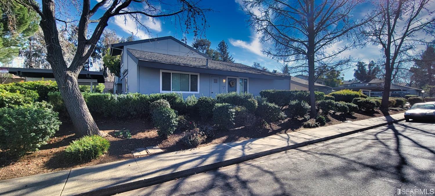 1200 Kenwal Road, Unit D Concord, CA 94521 - Photo 10 of 14 a house with trees in front of it