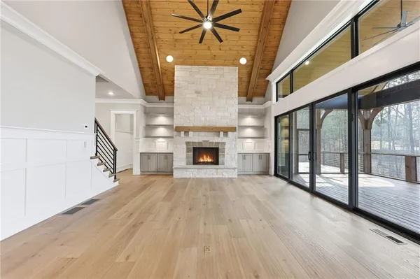 a view of a room with a ceiling fan