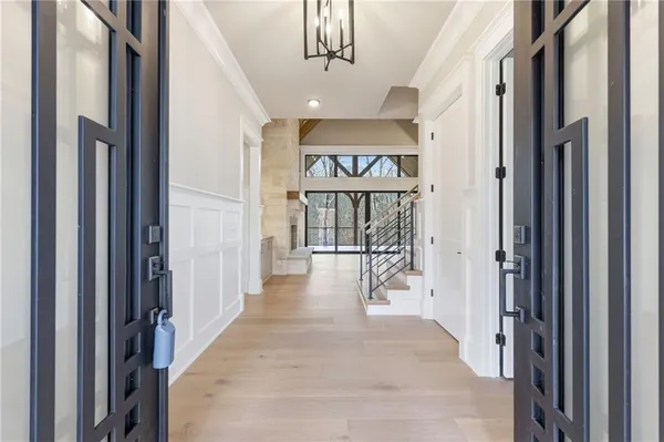 a large kitchen with a large counter top appliances and cabinets