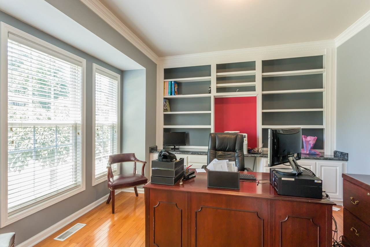1909 Wescott Drive Raleigh, NC 27614 - Photo 11 of 25 First Floor Office Features Wall of Built-Ins and French Doors for Privacy