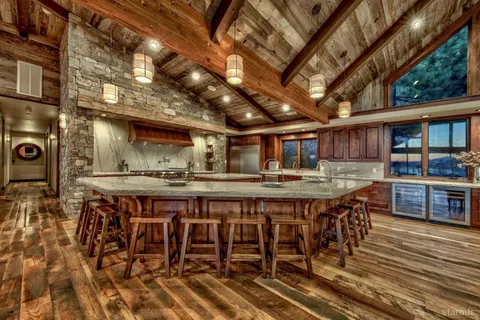 a dining table with chairs and wooden floor
