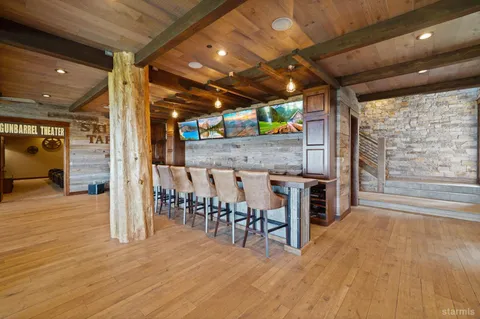 a view of a hall with wooden floor