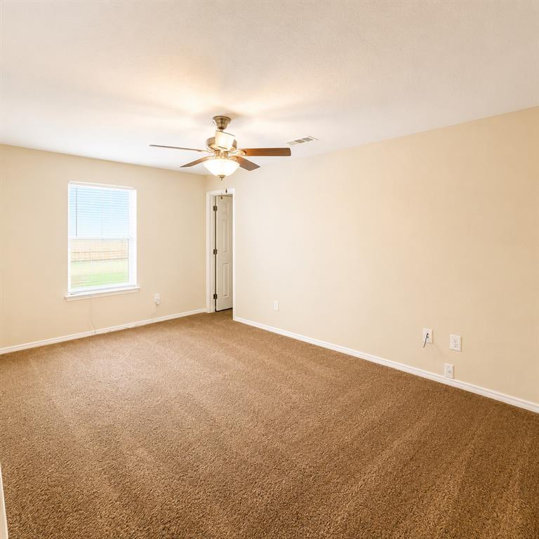 2003 Firefly Circle Waco, TX 76705 - Photo 16 of 29 Spacious room featuring neutral-toned walls and brown plush carpeting