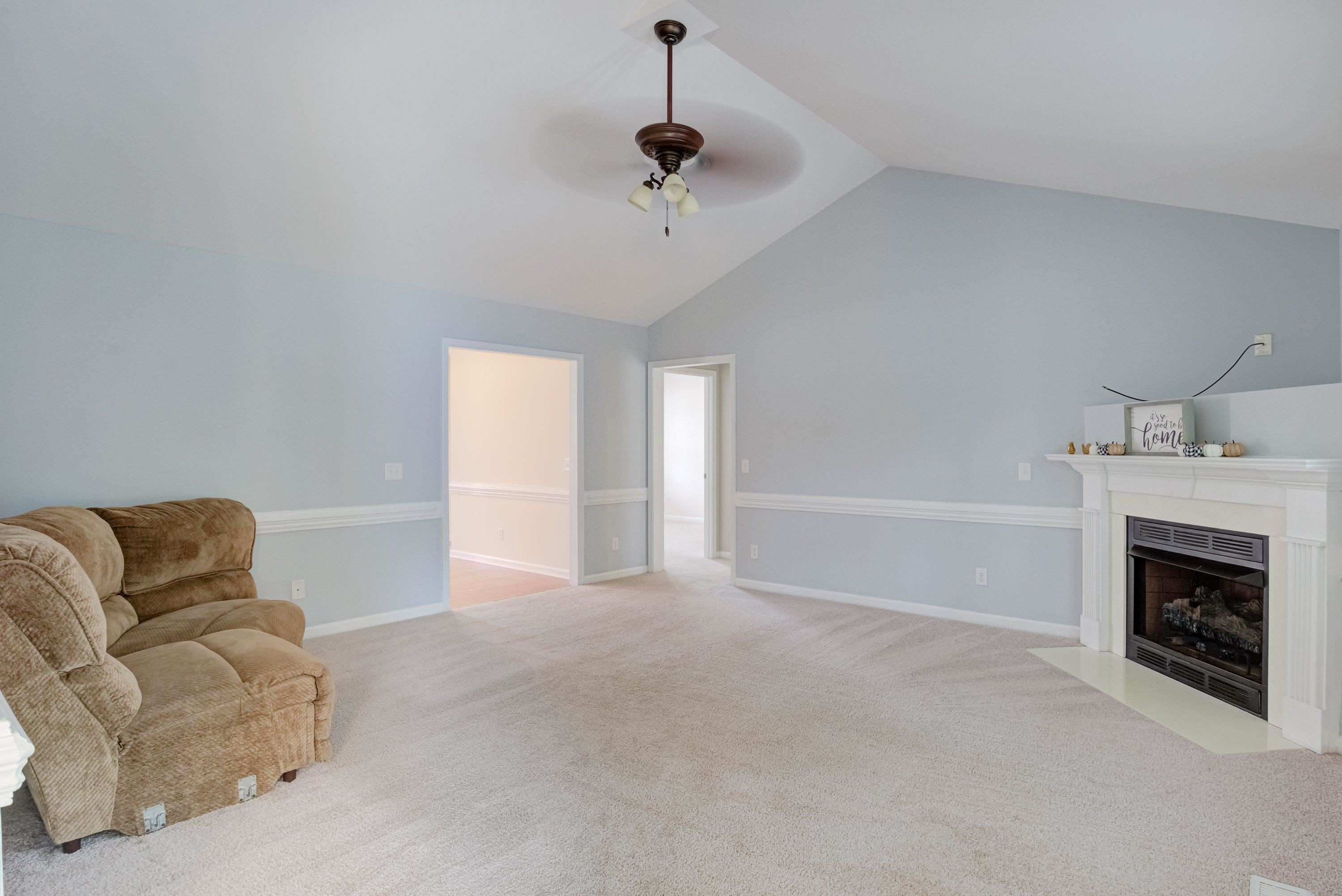 345 Axum Road Willow Spring, NC 27592 - Photo 11 of 38 Family room with corner fireplace & vaulted ceilings!