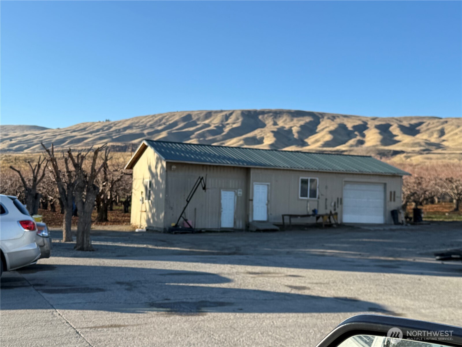 556 Jack Wells Road Bridgeport, WA 98813 - Photo 12 of 13 a front view of a house with a yard