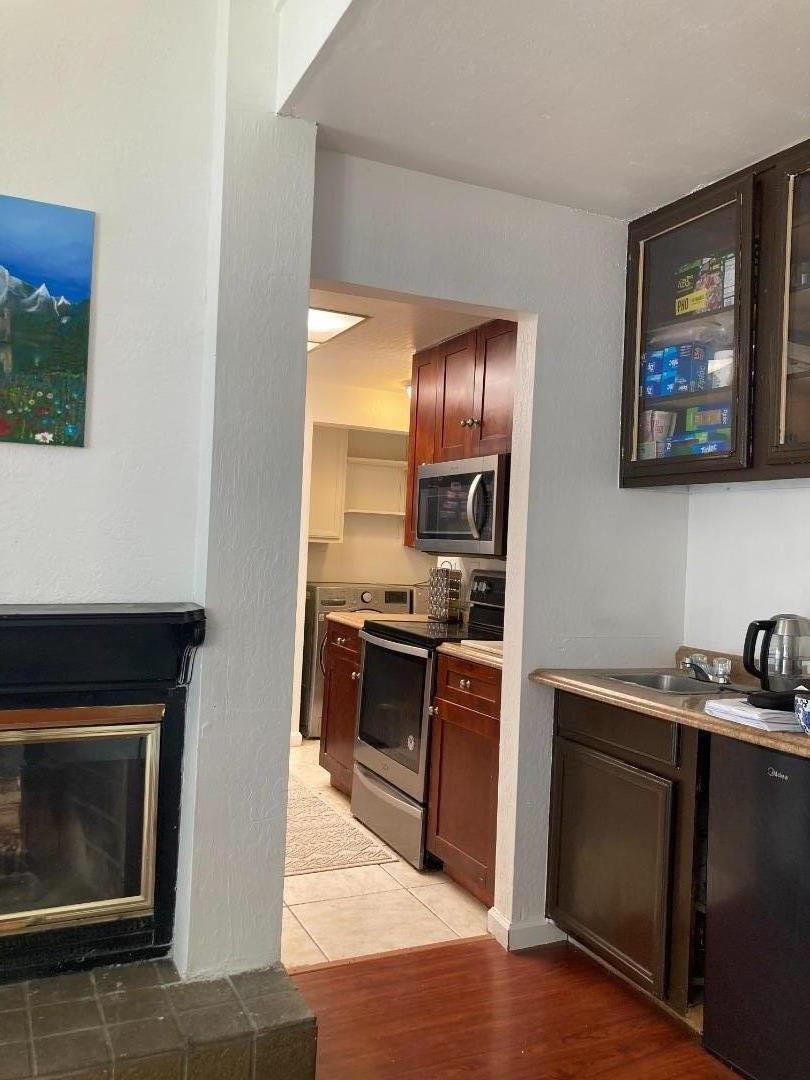 3660 Wells Road Oakley, CA 94561 - Photo 24 of 63 a kitchen with stainless steel appliances granite countertop a stove top oven and sink