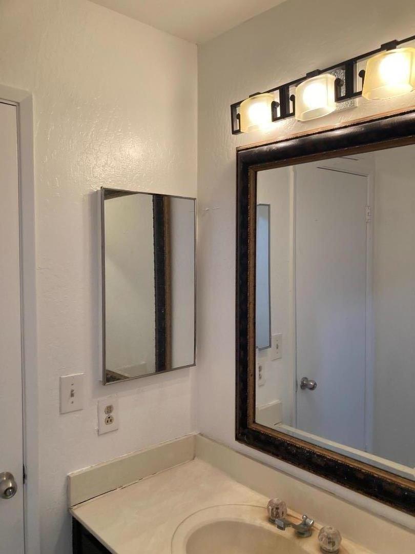 3660 Wells Road Oakley, CA 94561 - Photo 28 of 63 a bathroom with a sink and a mirror