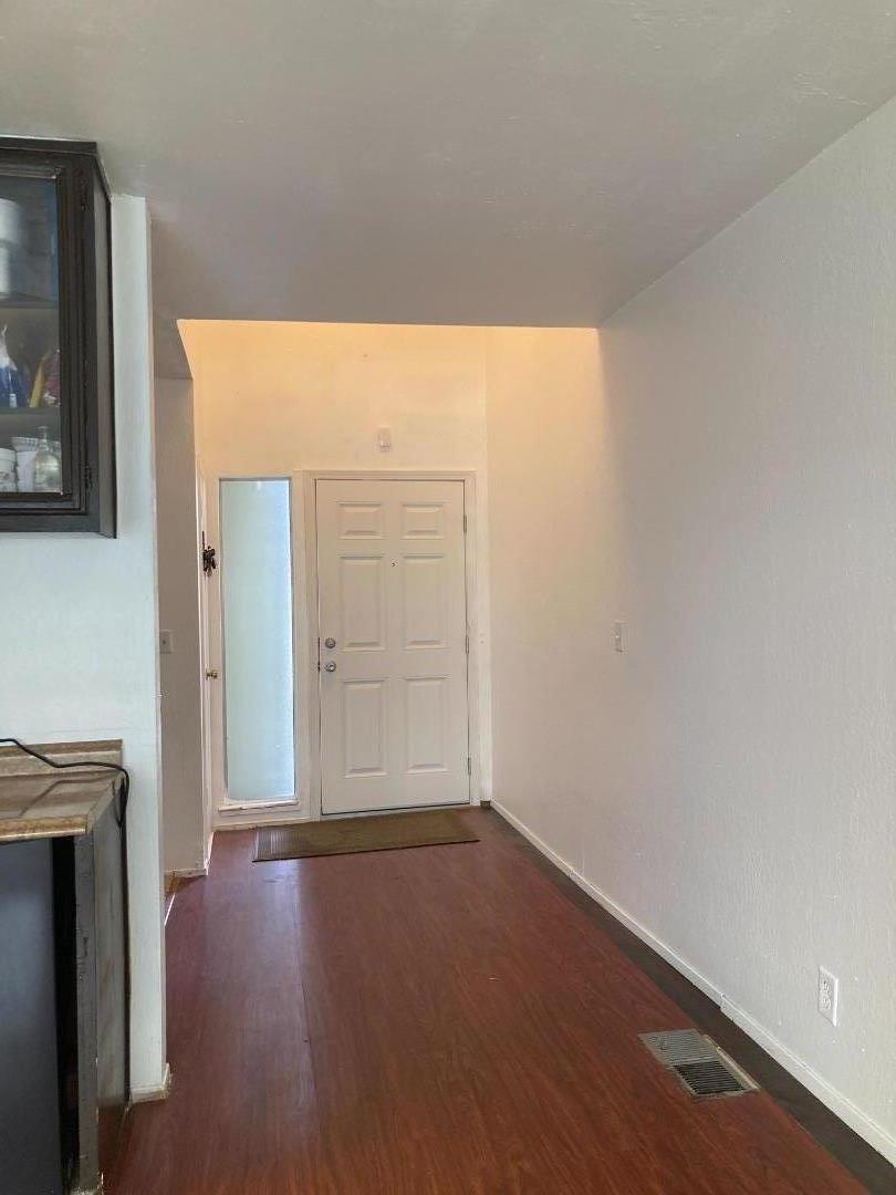 3660 Wells Road Oakley, CA 94561 - Photo 4 of 63 an empty room with wooden floor closet and windows