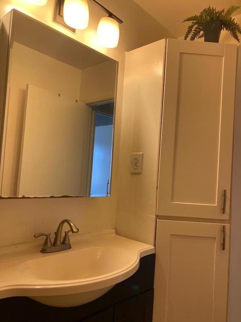 3660 Wells Road Oakley, CA 94561 - Photo 41 of 63 a bathroom with a sink and a mirror