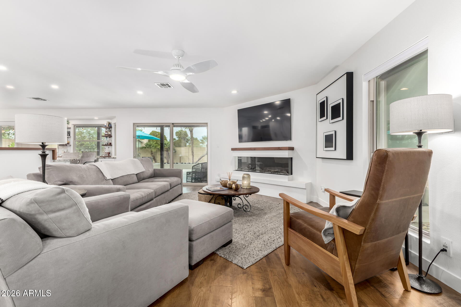 3220 East Hatcher Road Phoenix, AZ 85028 - Photo 12 of 50 a living room with fireplace furniture and a flat screen tv