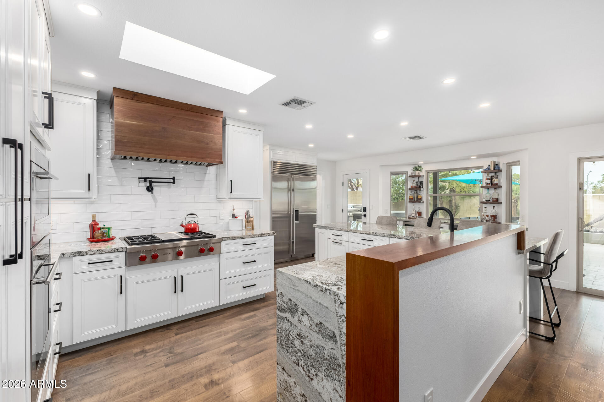3220 East Hatcher Road Phoenix, AZ 85028 - Photo 14 of 50 a kitchen with stainless steel appliances granite countertop a sink and cabinets