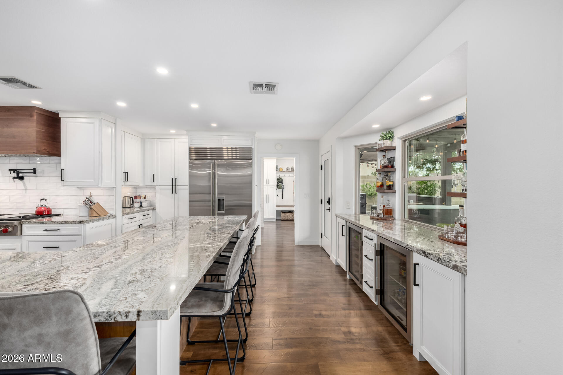 3220 East Hatcher Road Phoenix, AZ 85028 - Photo 15 of 50 a large kitchen with kitchen island granite countertop lots of counter space and wooden floor