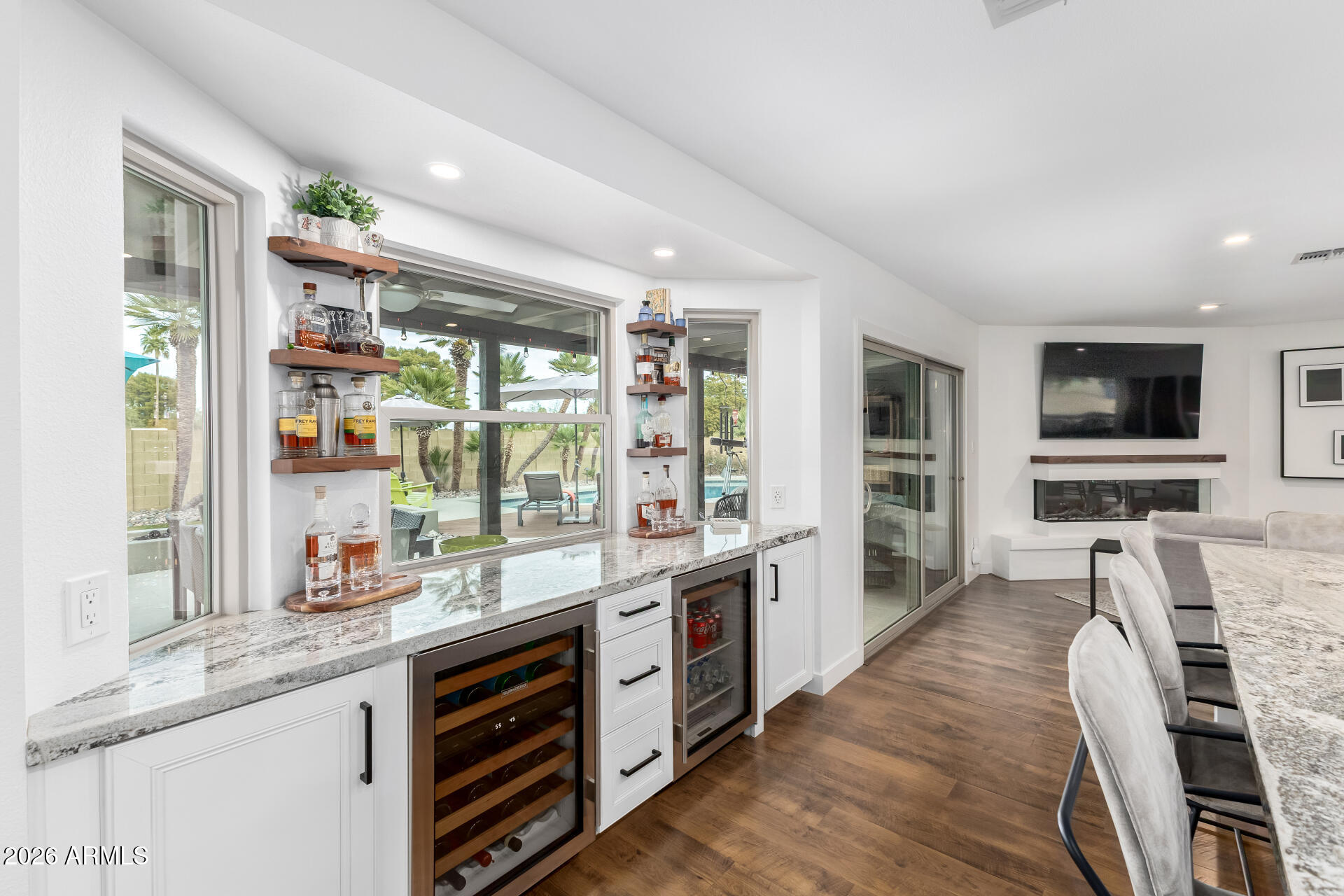 3220 East Hatcher Road Phoenix, AZ 85028 - Photo 17 of 50 a kitchen with stainless steel appliances granite countertop a stove and cabinets