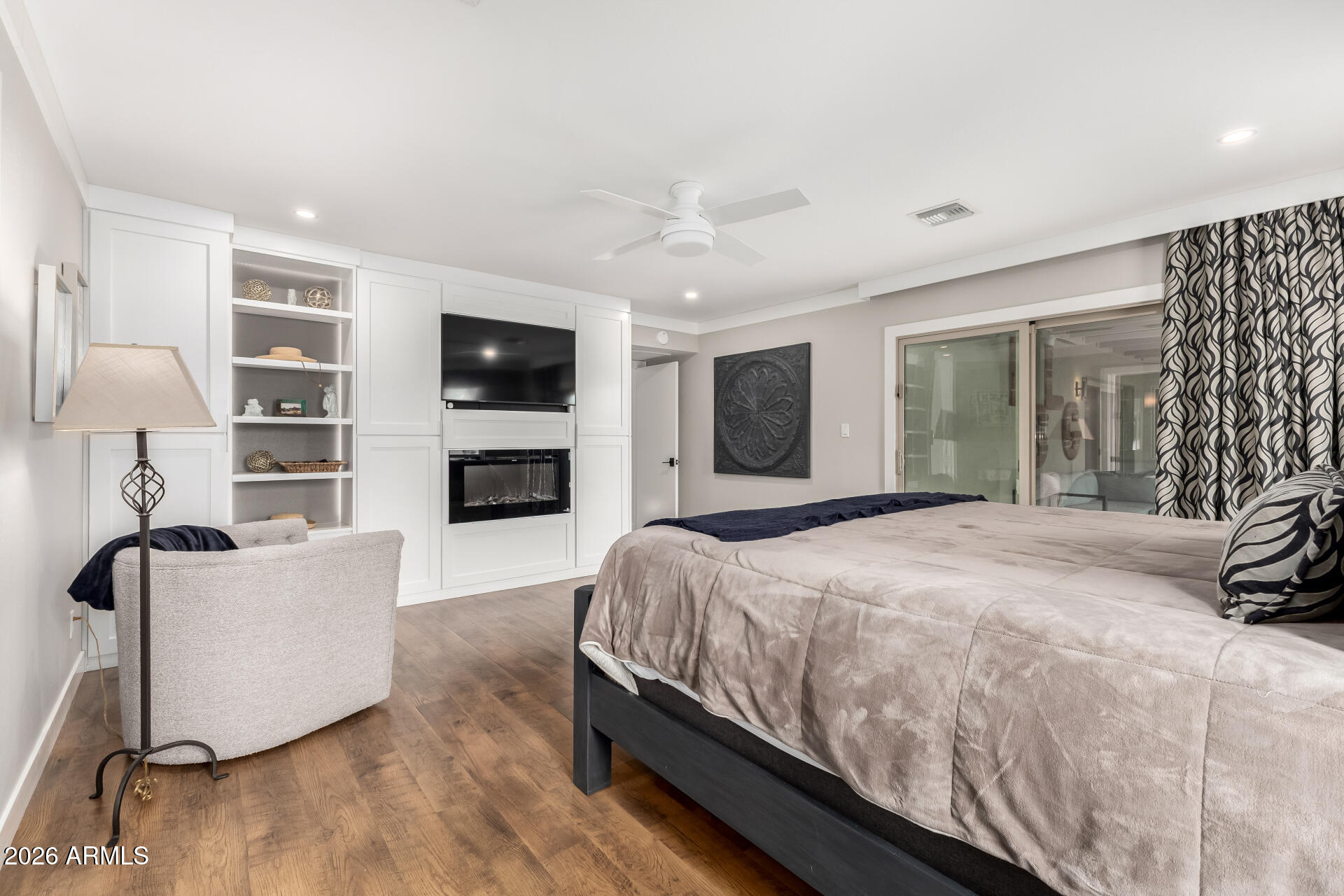 3220 East Hatcher Road Phoenix, AZ 85028 - Photo 21 of 50 a spacious bedroom with a bed and a flat screen tv