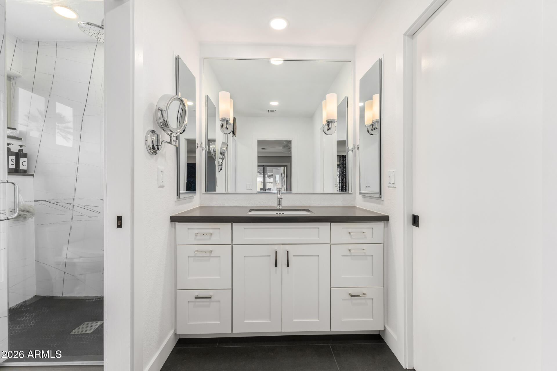 3220 East Hatcher Road Phoenix, AZ 85028 - Photo 22 of 50 a bathroom with a granite countertop sink two mirror and shower