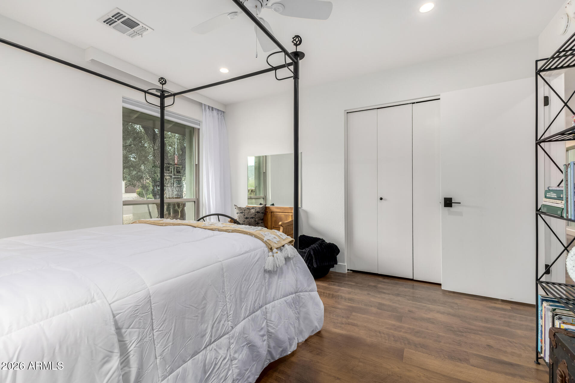 3220 East Hatcher Road Phoenix, AZ 85028 - Photo 26 of 50 a bedroom with a bed window and a ceiling fan