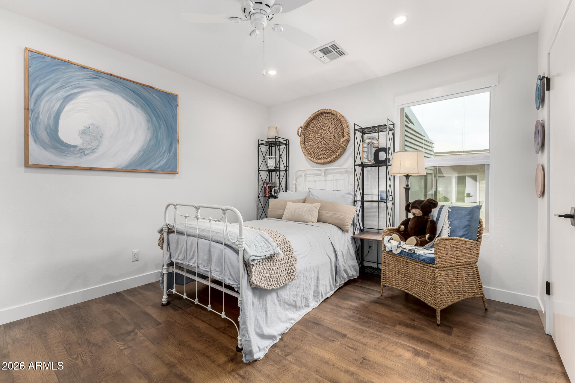 3220 East Hatcher Road Phoenix, AZ 85028 - Photo 27 of 50 a living room with a bed furniture and a window