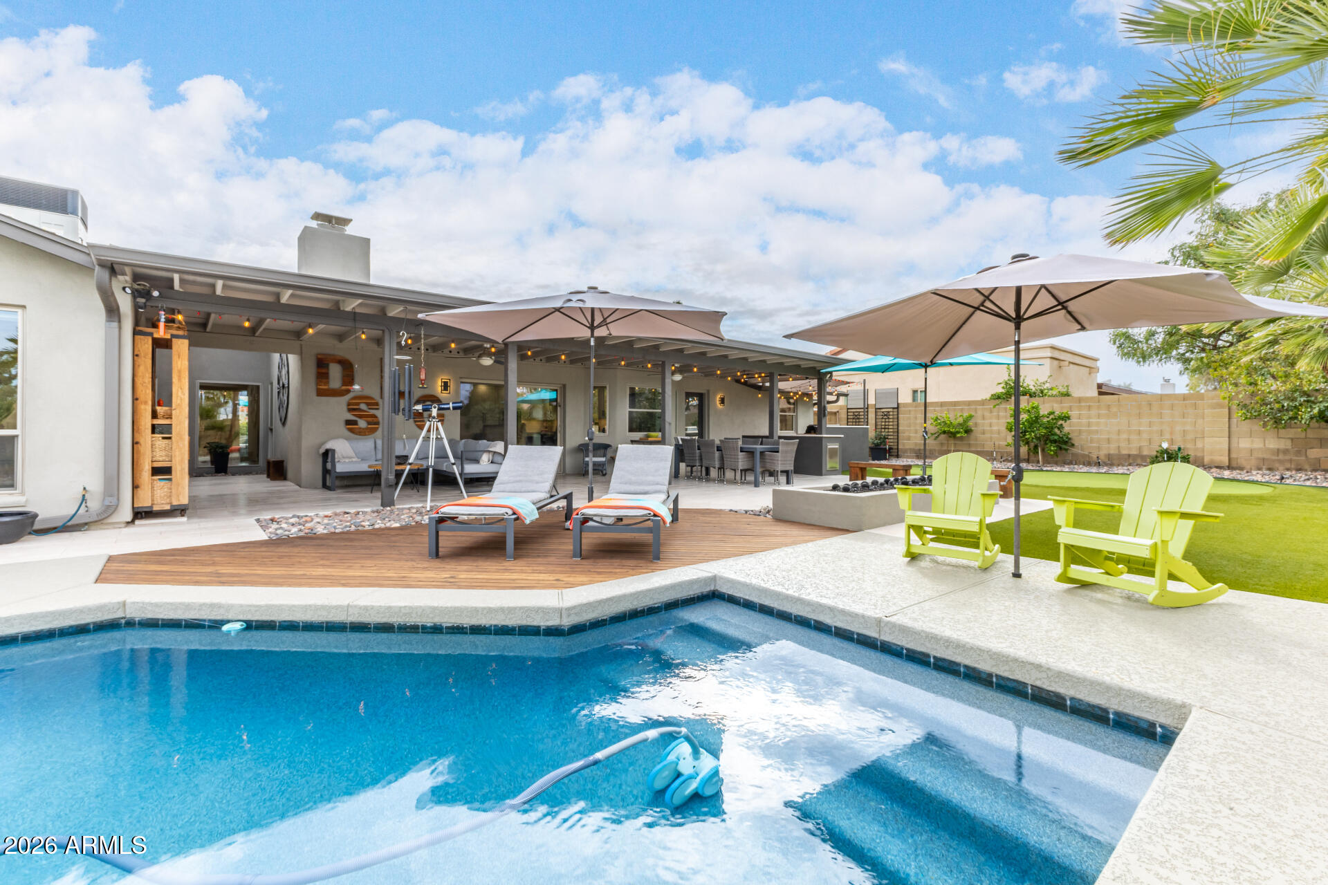 3220 East Hatcher Road Phoenix, AZ 85028 - Photo 40 of 50 a view of a swimming pool with lounge chairs in the patio
