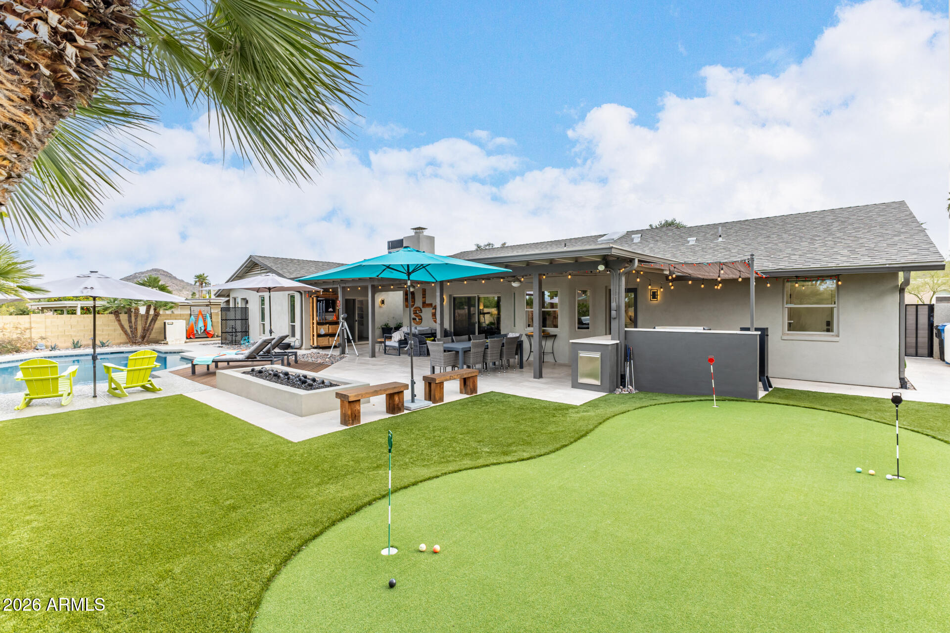 3220 East Hatcher Road Phoenix, AZ 85028 - Photo 44 of 50 a view of a house with swimming pool and sitting area