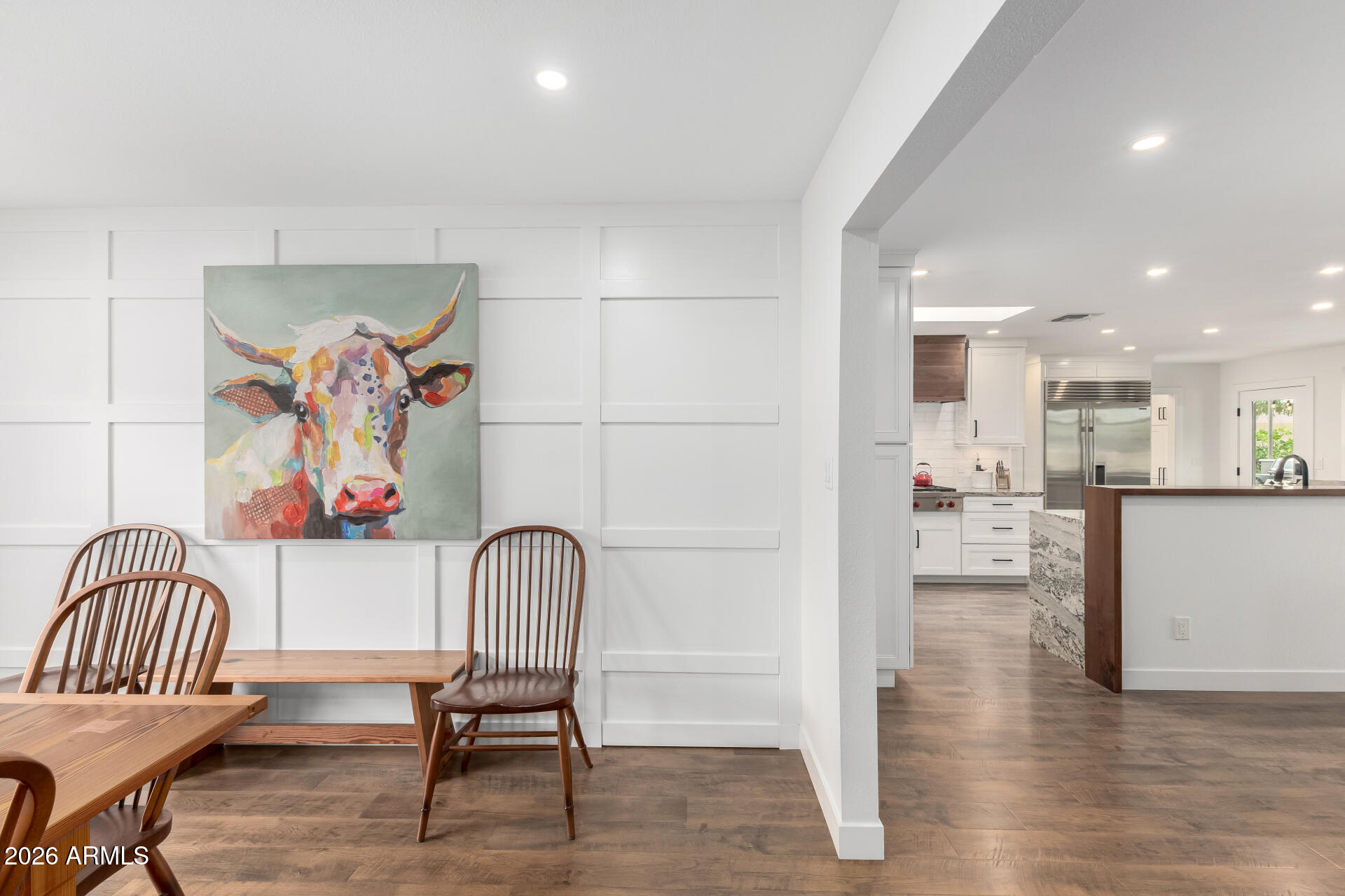 3220 East Hatcher Road Phoenix, AZ 85028 - Photo 10 of 50 a view of a dining room with furniture and wooden floor