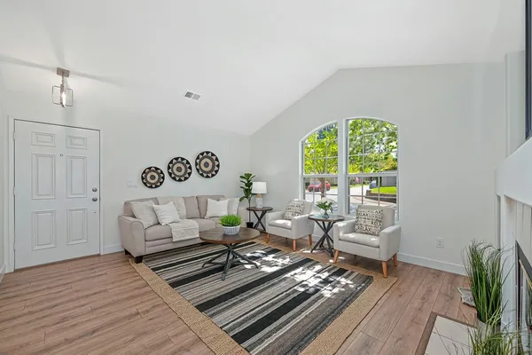 a dining room with furniture and window