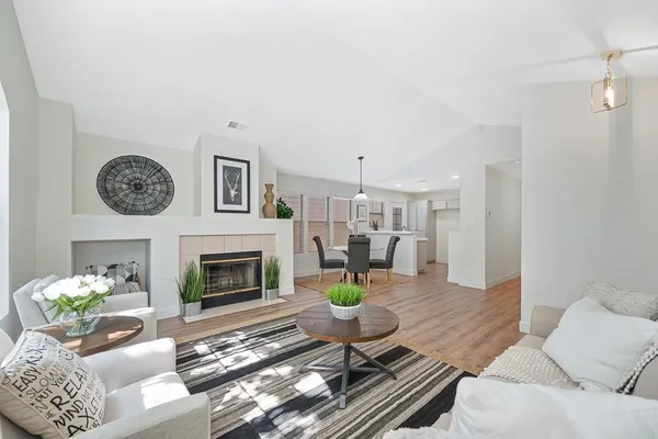 a kitchen with stainless steel appliances granite countertop a refrigerator sink and stove