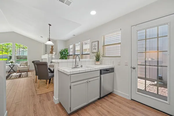 a bathroom with a double vanity sink mirror and