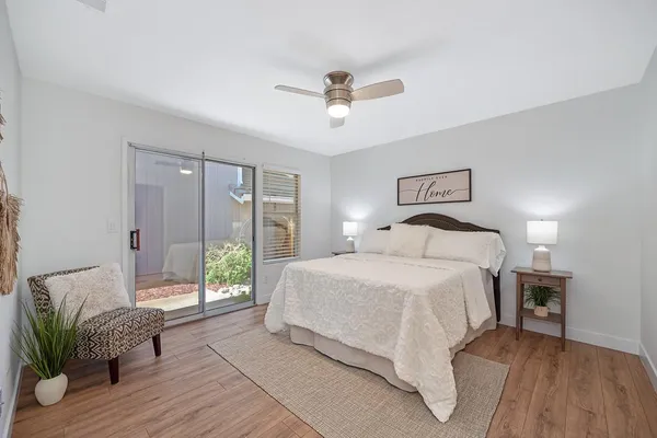 an aerial view of a house with a yard and potted plants