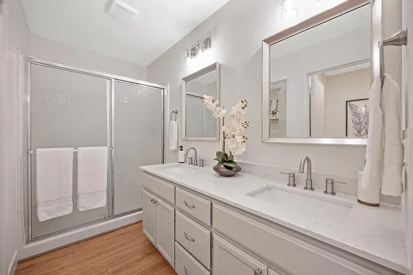 an aerial view of a house with a yard and lake view