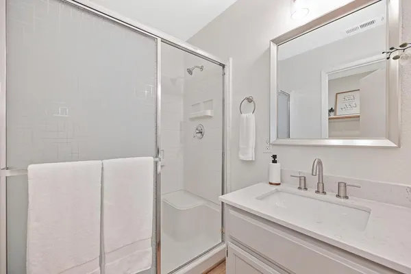a view of a patio with table and chairs potted plants