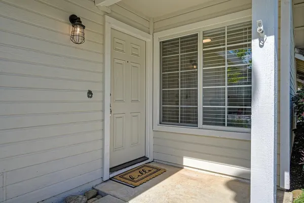 a living room with furniture a fireplace and a table