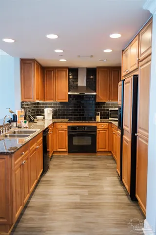 a view of a dining room with furniture wooden floor and chandelier
