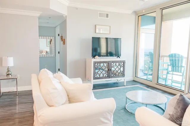 a living room with a couch and a large window