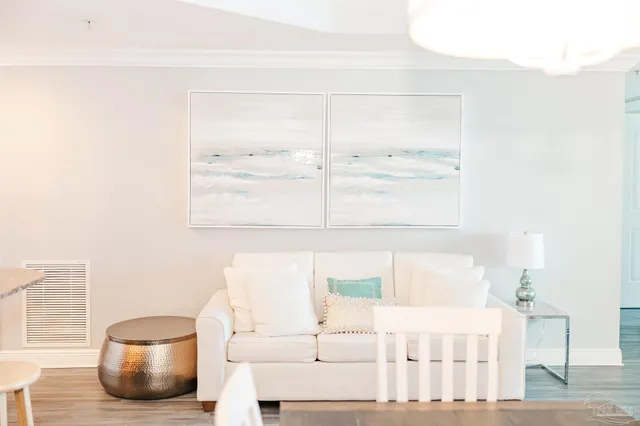 a view of a hallway with wooden floor and closet area